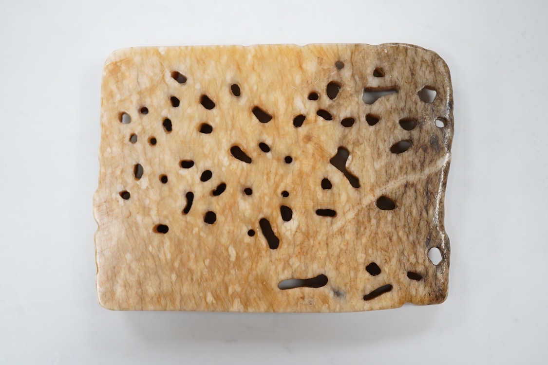 A Chinese russet jade rectangular plaque, 7cm wide
